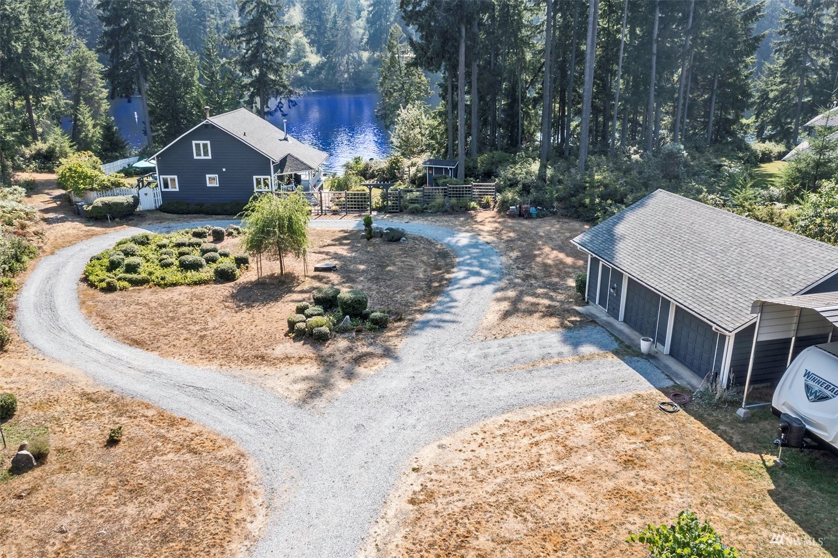 10518 Guthrie Road Anderson Island, WA 98303 - Photo 37 of 40 a front view of a house with a yard