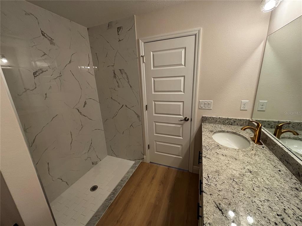 3148 Southwest 145th Court Ocala, FL 34481 - Photo 12 of 17 a bathroom with a tub sink and mirror