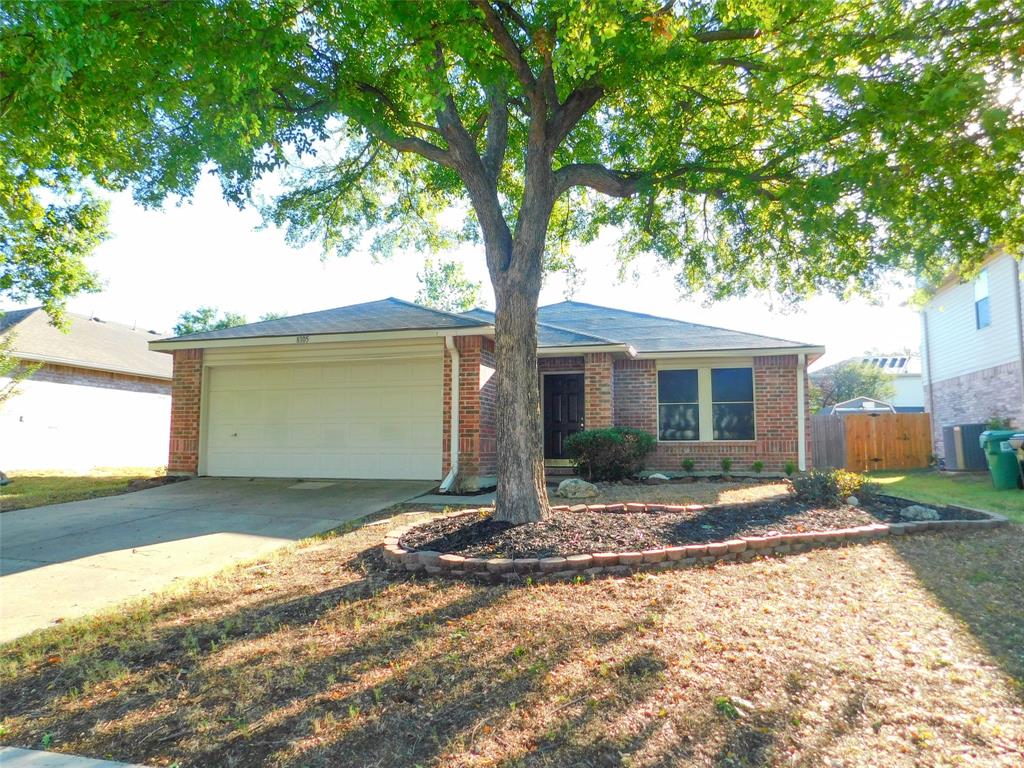8105 Winding Stream Lane Denton, TX 76210 - Photo 1 of 28 a front view of a house with a yard and garage