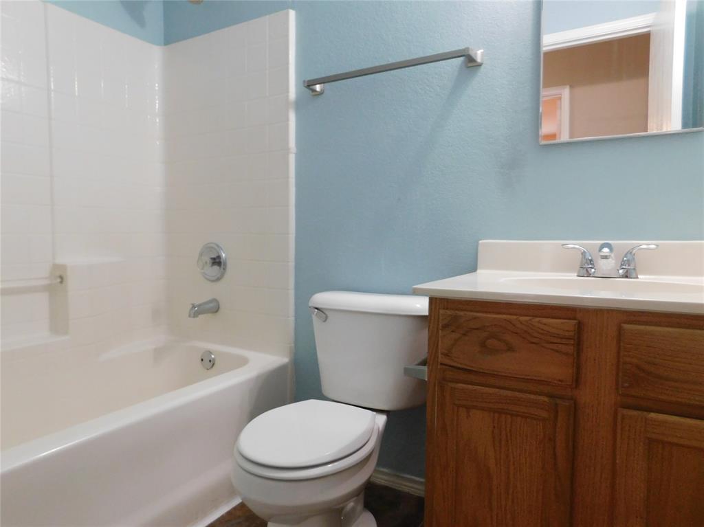 8105 Winding Stream Lane Denton, TX 76210 - Photo 17 of 28 a bathroom with a sink toilet and shower
