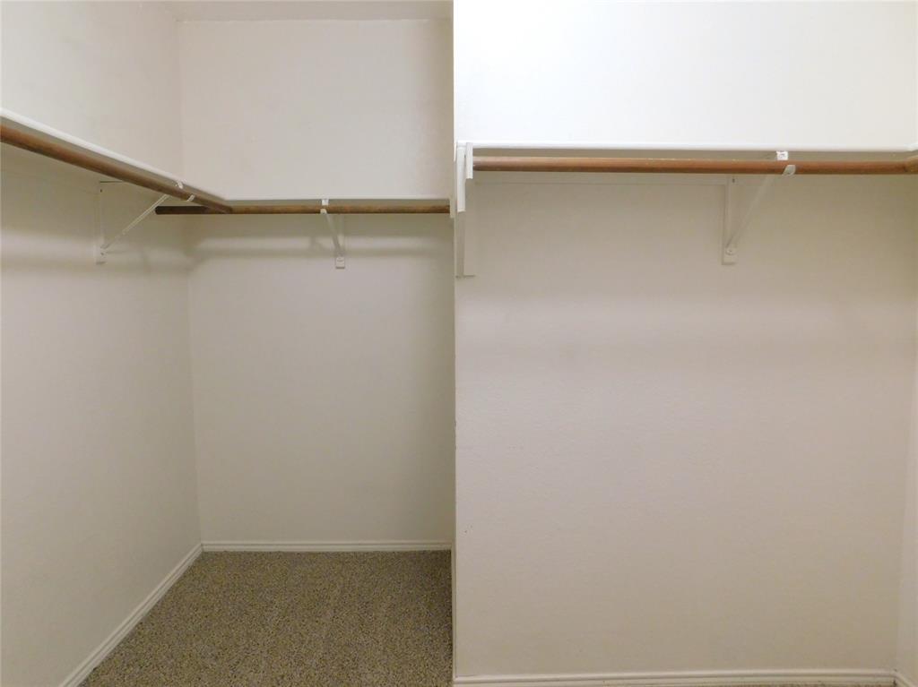 8105 Winding Stream Lane Denton, TX 76210 - Photo 22 of 28 a view of small space with racks on the wall