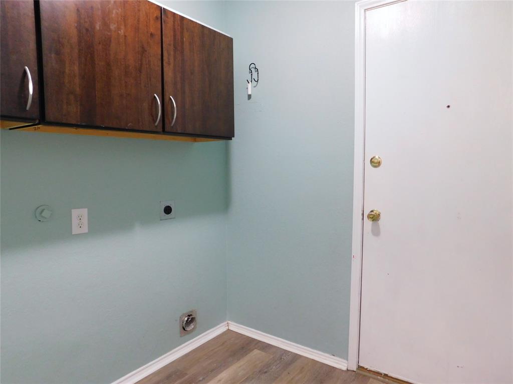 8105 Winding Stream Lane Denton, TX 76210 - Photo 23 of 28 a view of storage and utility room with wooden floor