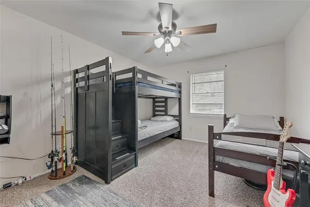 a bedroom with furniture and a chandelier