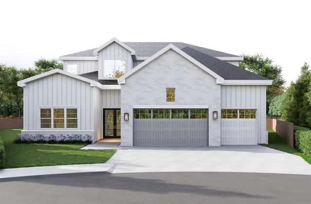 a front view of a house with a garden and plants
