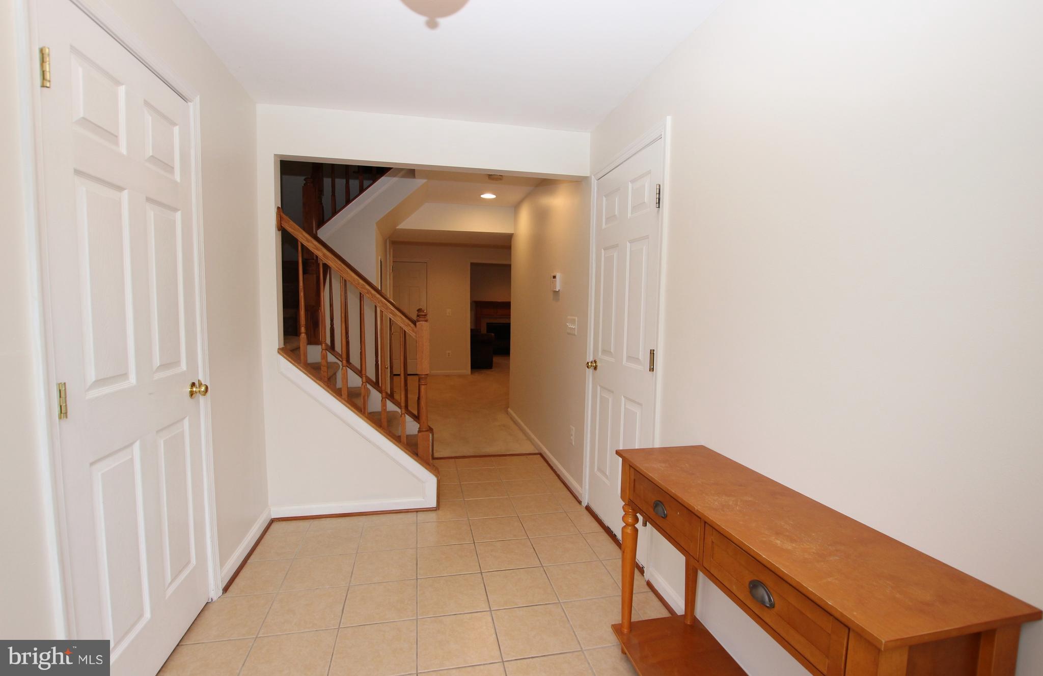 1315 Steed Street Ranson, WV 25438 - Photo 4 of 30 a view of hallway with stairs and a couch