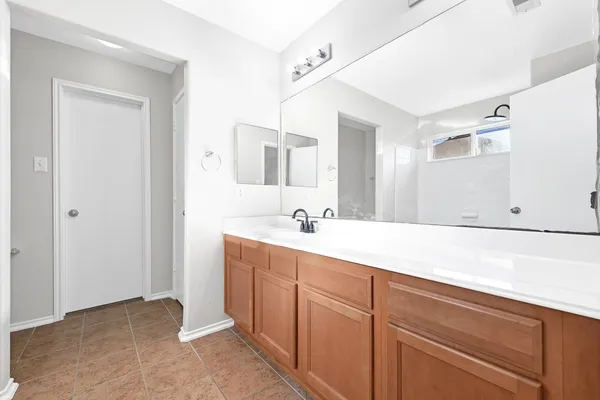 a white bath tub sitting next to a window