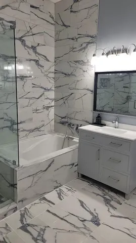 a bathroom with a sink and a bathtub