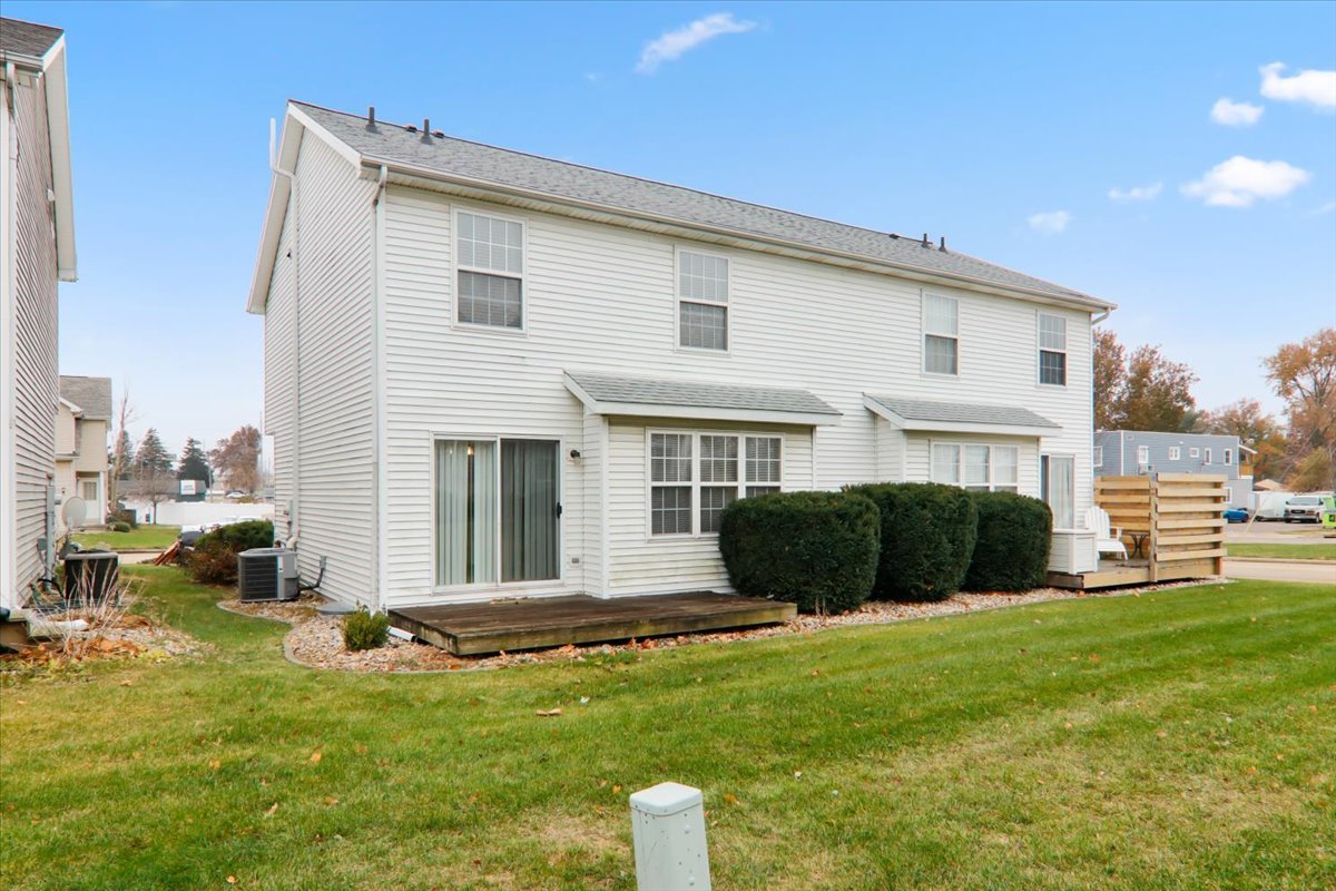 1204 Colonial Avenue Bloomington, IL 61701 - Photo 16 of 17 a front view of a house with a garden and yard