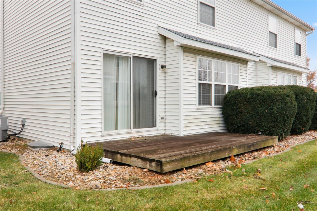 1204 Colonial Avenue Bloomington, IL 61701 - Photo 17 of 17 a view of a wooden door and a yard
