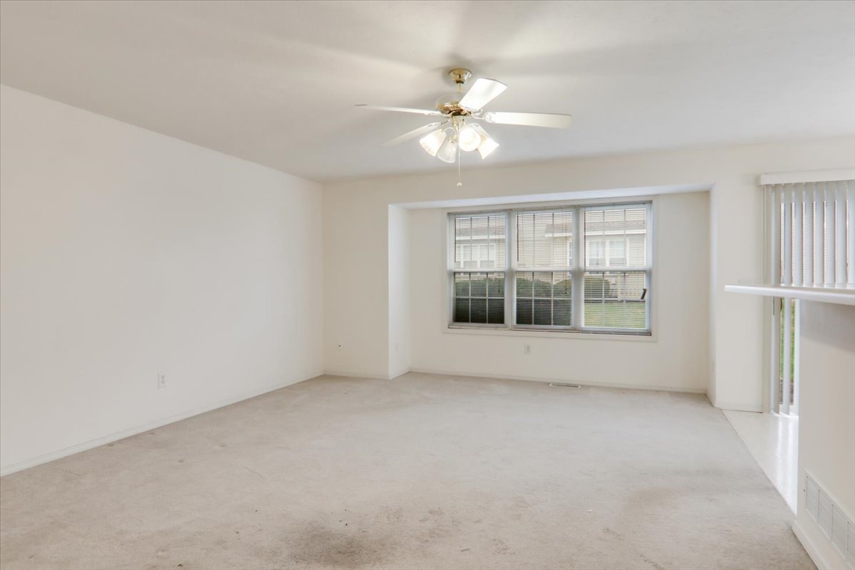 1204 Colonial Avenue Bloomington, IL 61701 - Photo 2 of 17 a view of an empty room with a window