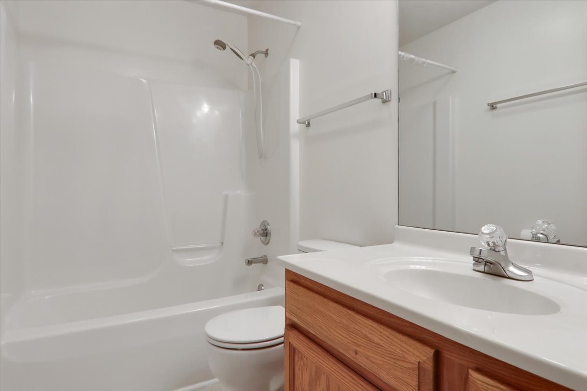 1204 Colonial Avenue Bloomington, IL 61701 - Photo 10 of 17 a bathroom with a sink a toilet and shower