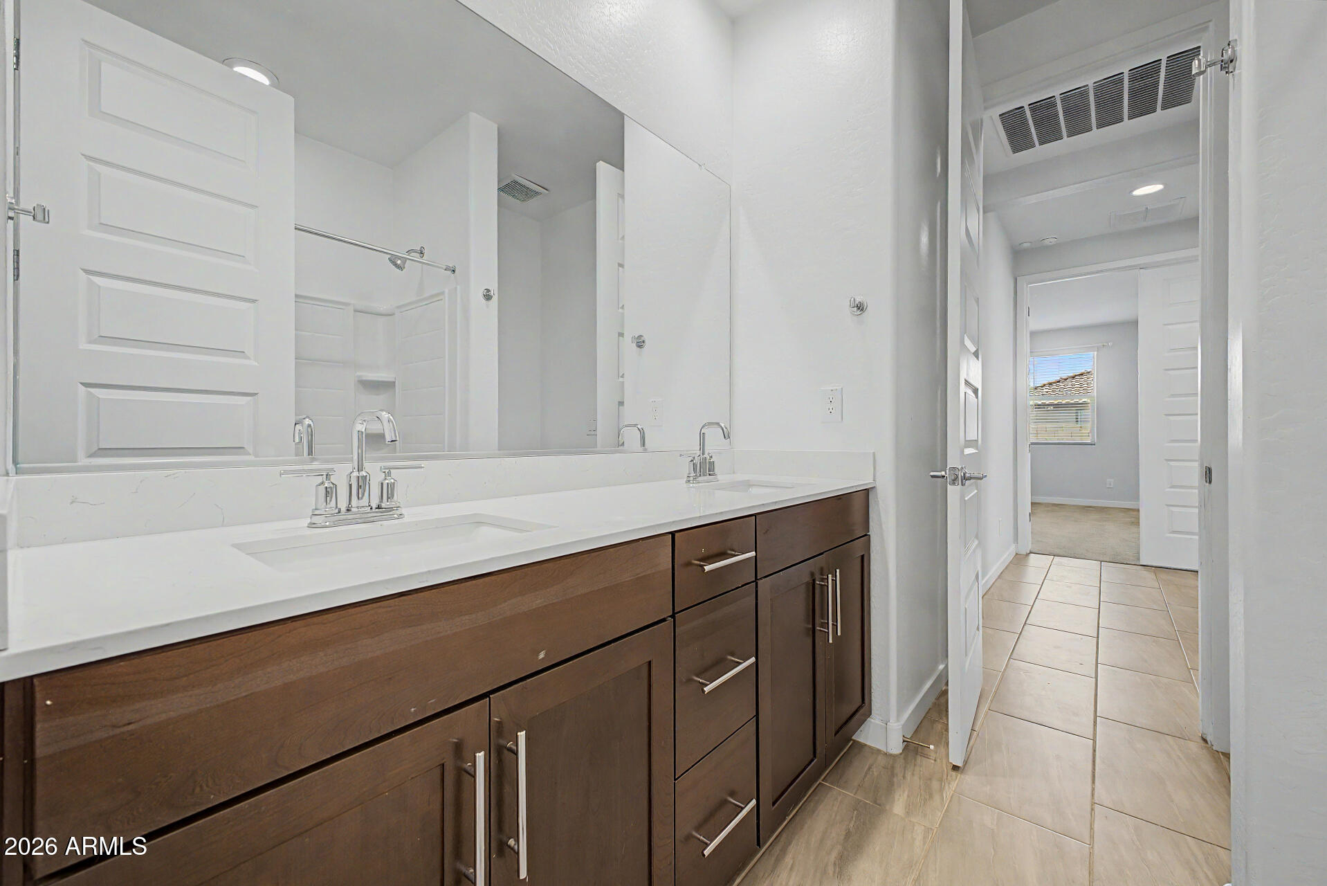 23080 East Stacey Road Queen Creek, AZ 85142 - Photo 27 of 42 a bathroom with a double vanity sink and a mirror