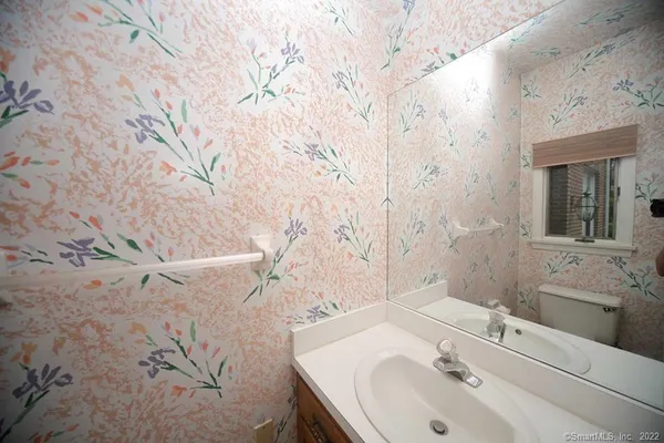 a bathroom with a sink and vanity