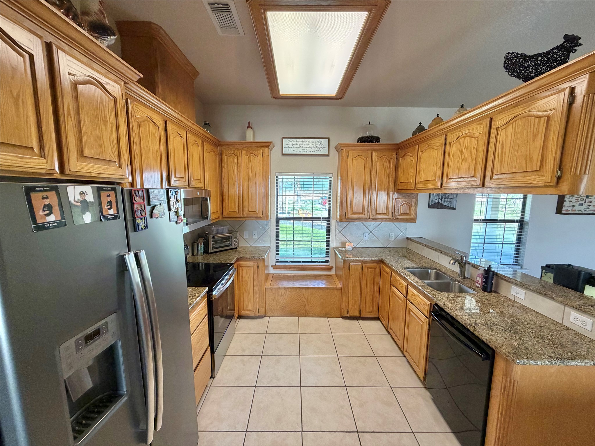 15903 County Road 621 Angleton, TX 77515 - Photo 14 of 33 a kitchen with stainless steel appliances granite countertop a sink stove and refrigerator