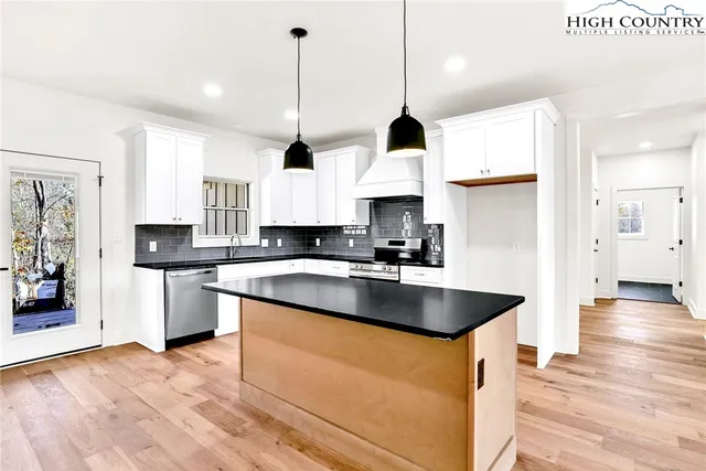 a view of a room with wooden floor and closet