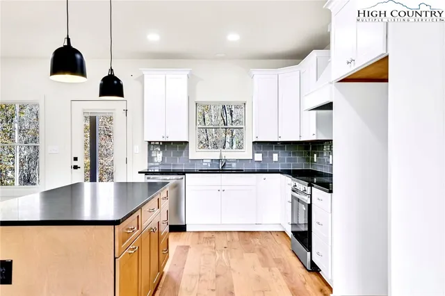 a bedroom with a bed and glass window