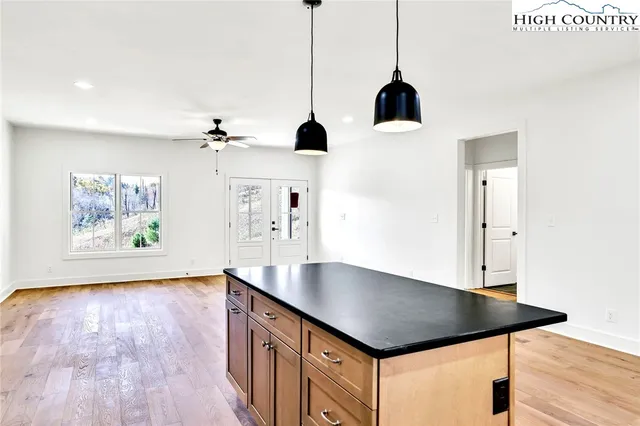 a bathroom with a granite countertop sink mirror and vanity
