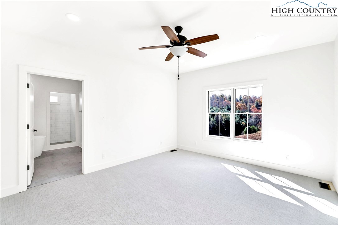 201 Whispering River Drive Crumpler, NC 28617 - Photo 26 of 48 a view of an empty room with a window