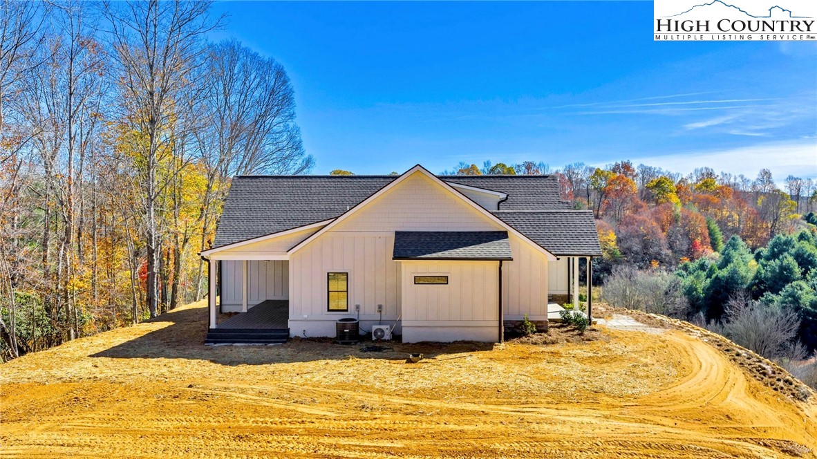 201 Whispering River Drive Crumpler, NC 28617 - Photo 8 of 48 a view of a house with a yard