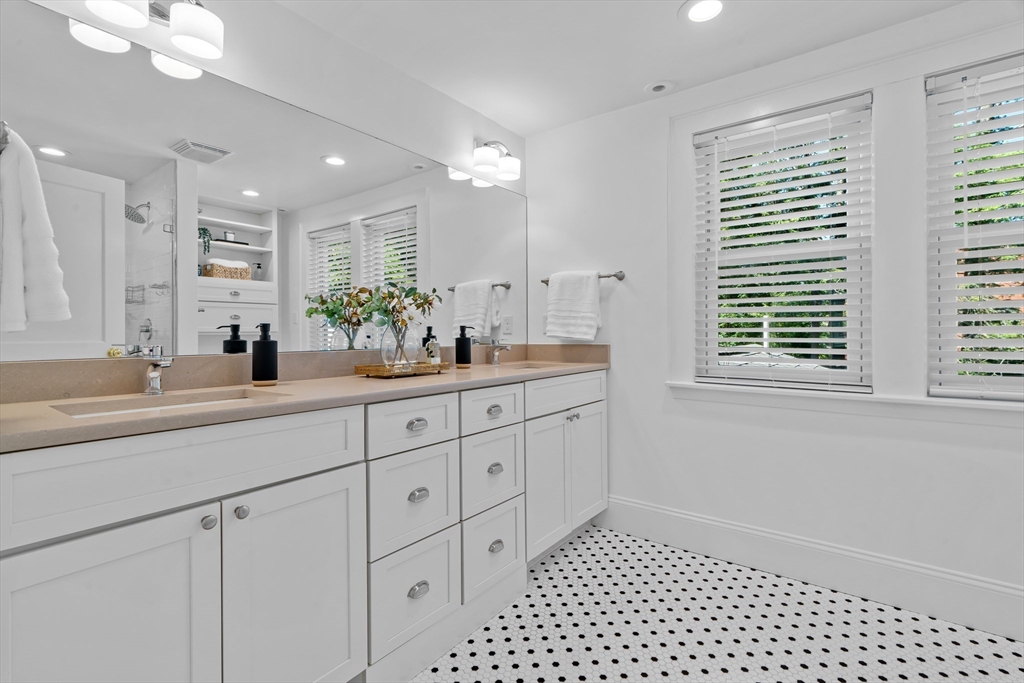 16 Vine Brook Road Lexington, MA 02421 - Photo 22 of 37 a bathroom with a sink double vanity and a shower