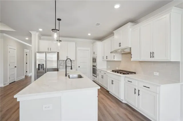 a view of wooden floor and windows in a room