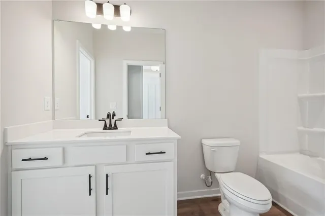 a bathroom with a double vanity sink mirror and shower