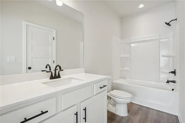 a bathroom with a shower and a glass door