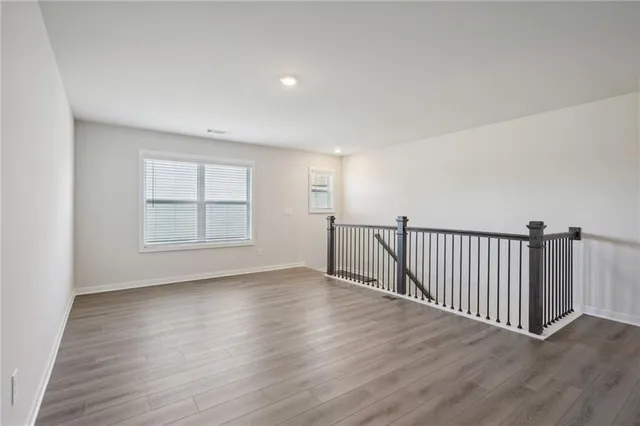 a view of a house with large trees