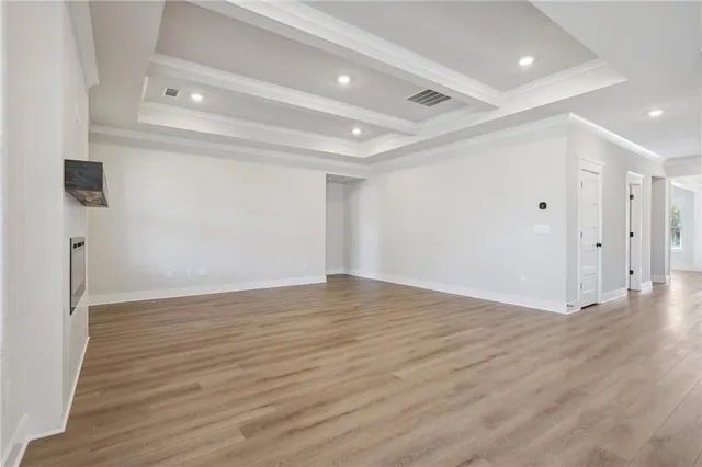 a view of kitchen with wooden floor and electronic appliances