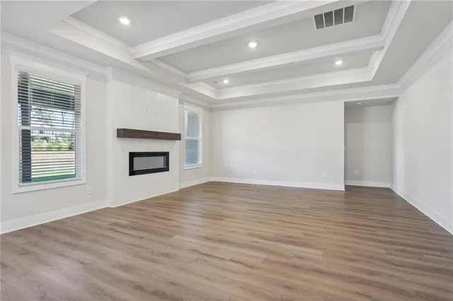 a large kitchen with granite countertop a large counter top stainless steel appliances and cabinets