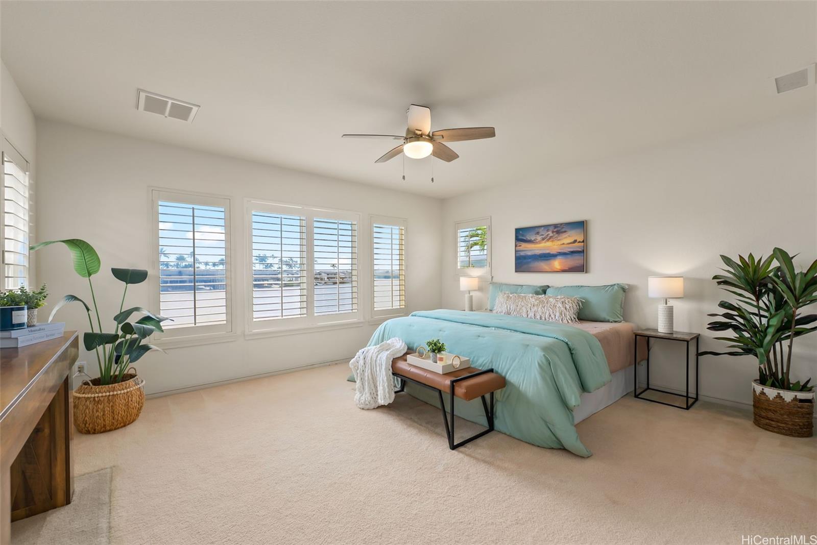 520 Lunalilo Home Road, Unit ER126 Honolulu, HI 96825 - Photo 15 of 25 a spacious bedroom with a bed and a chandelier