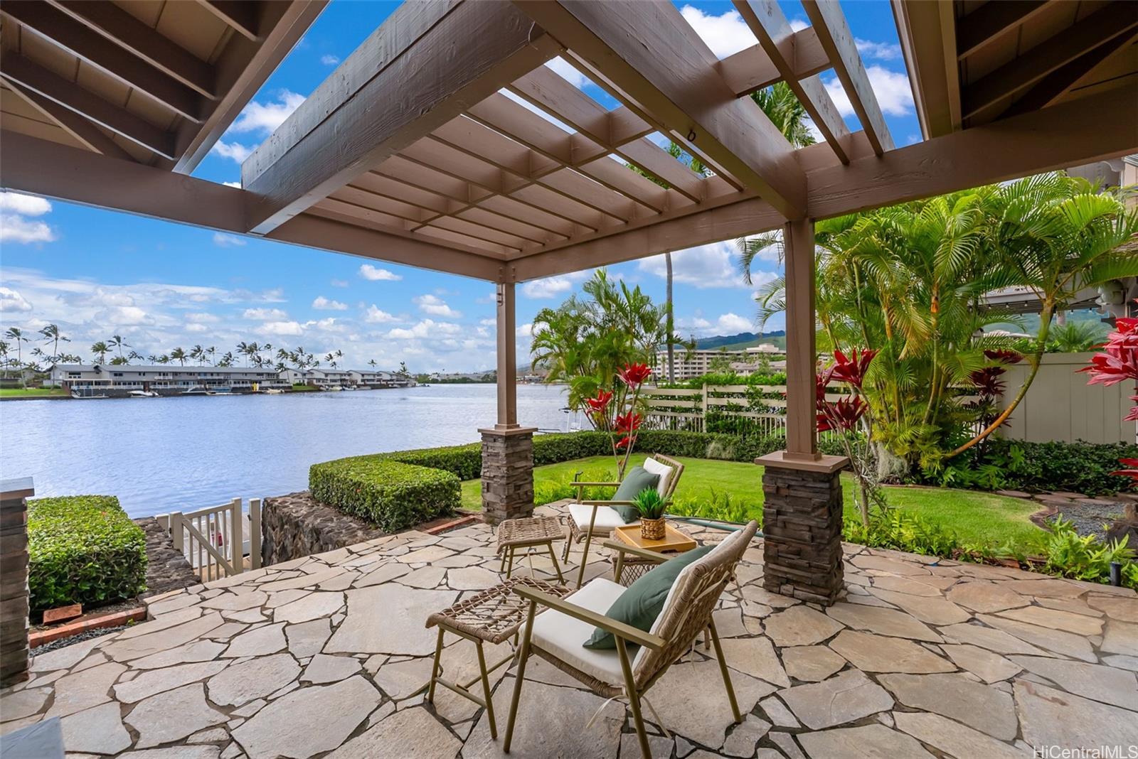 520 Lunalilo Home Road, Unit ER126 Honolulu, HI 96825 - Photo 5 of 25 a view of a patio with a table chairs and a table