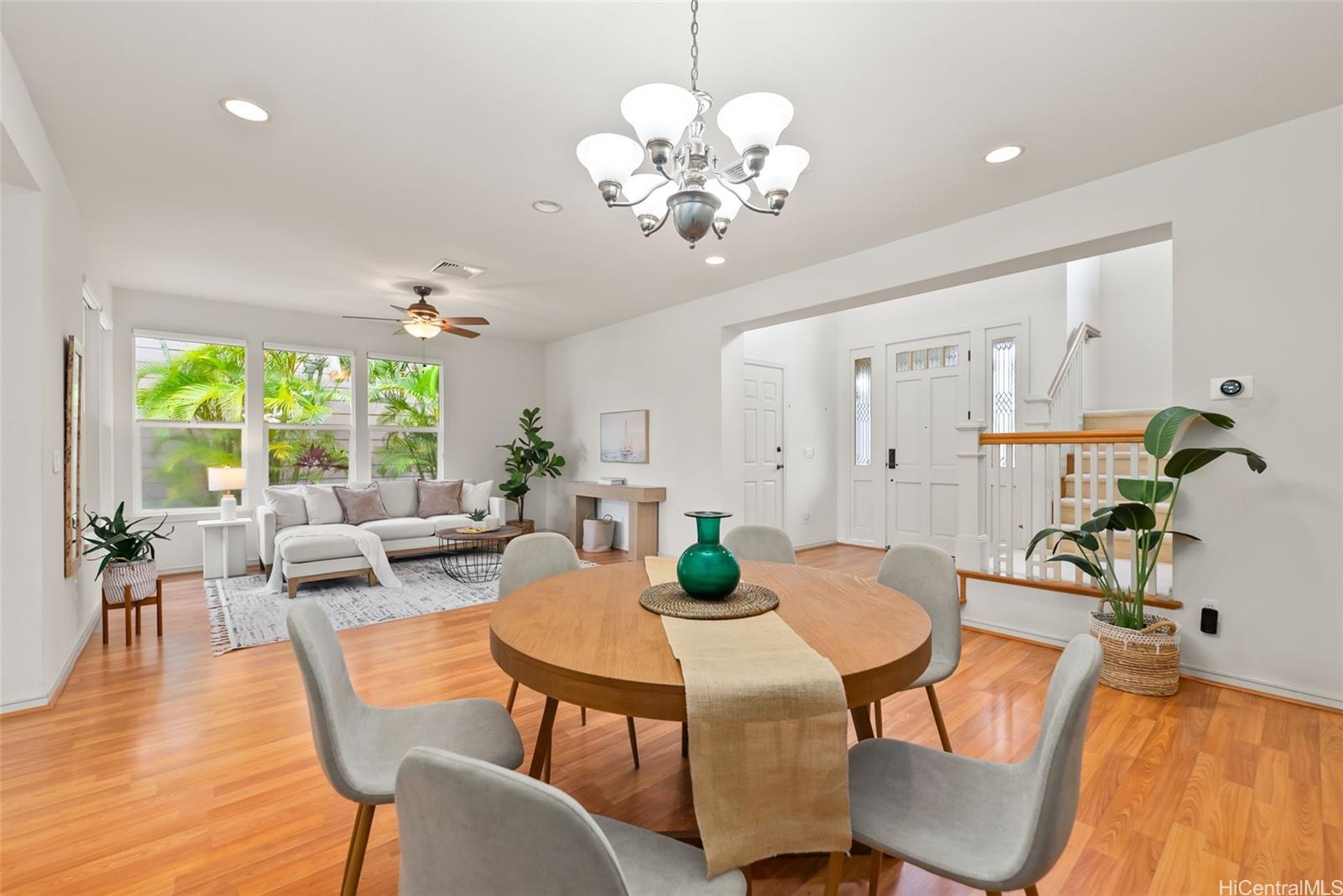 520 Lunalilo Home Road, Unit ER126 Honolulu, HI 96825 - Photo 7 of 25 a view of a dining room with furniture a chandelier and wooden floor