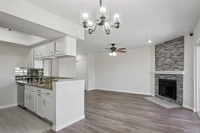 a kitchen with stainless steel appliances granite countertop a stove oven and a refrigerator
