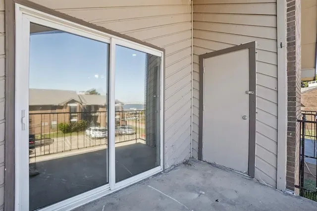 a view of a glass door of the house