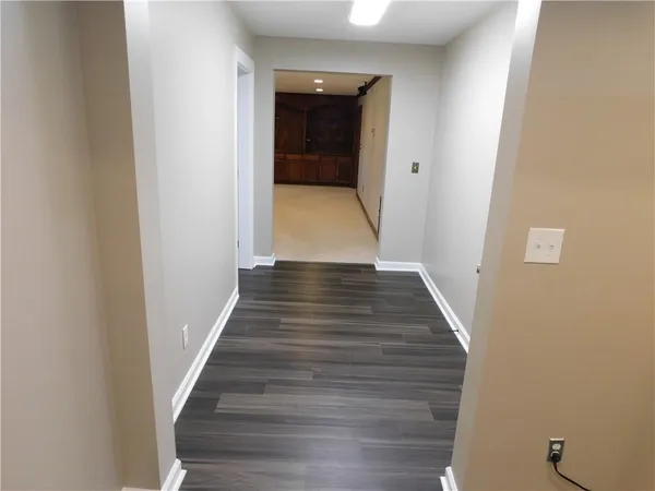 a view of a house with a yard and roof