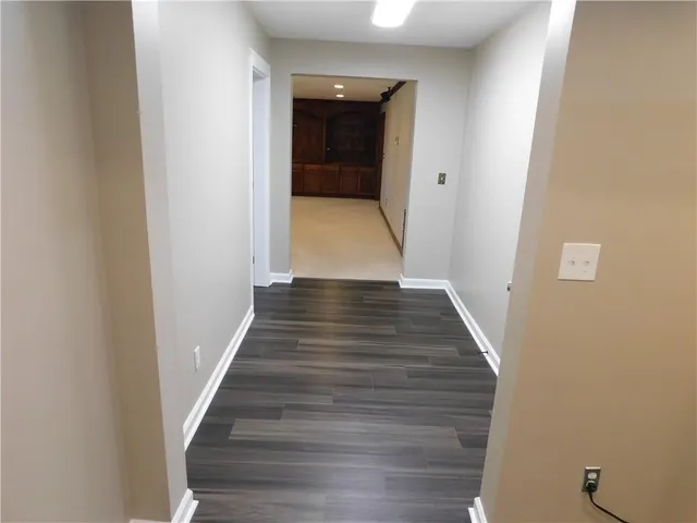 a view of a house with a yard and roof