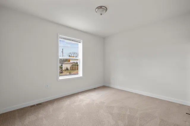 a bathroom with a granite countertop toilet a sink and a bathtub