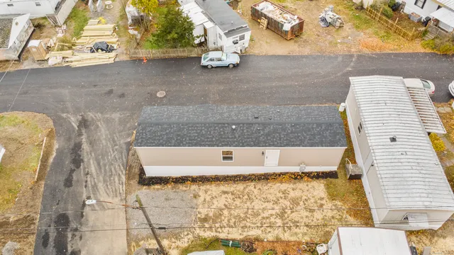 a view of a house with a snow in the yard