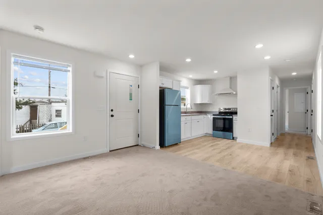 a view of a kitchen with a sink and a window