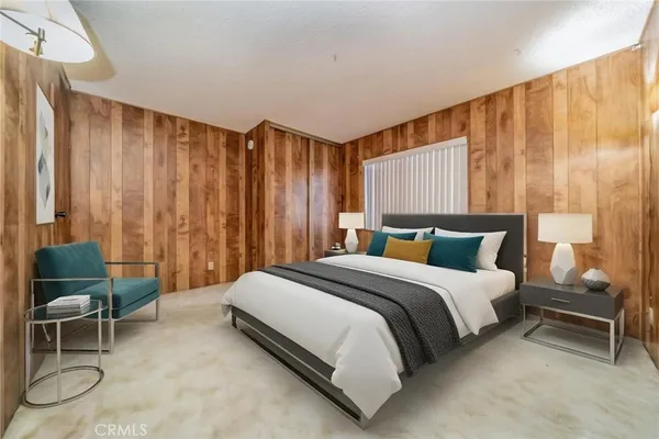 a view of a kitchen with fridge and wooden floor