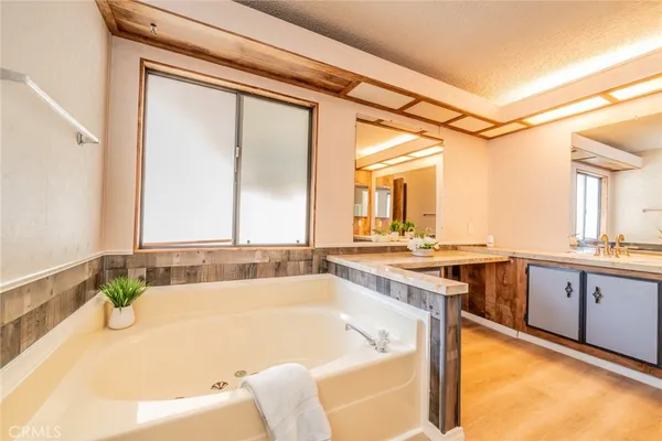 a bathroom with a tub and shower