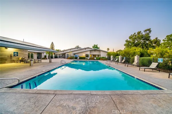 a view of a swimming pool with a patio
