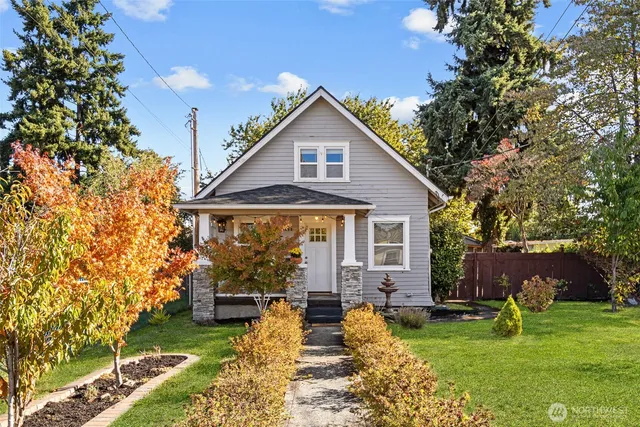 a view of a house with a yard porch and sitting area
