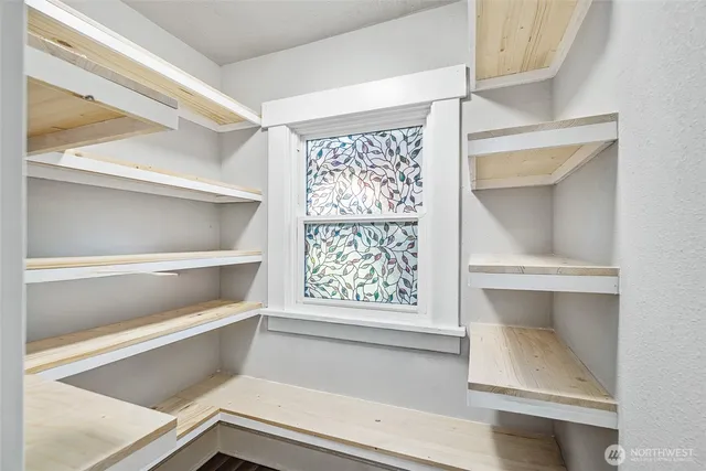 a view of room with window and cabinet