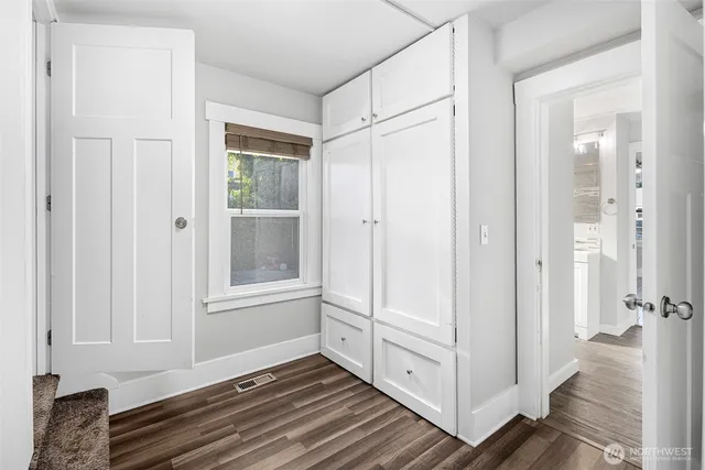 a view of a closet area with living room
