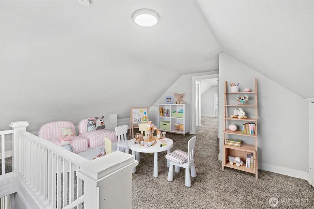 a bedroom with furniture and a baby crib