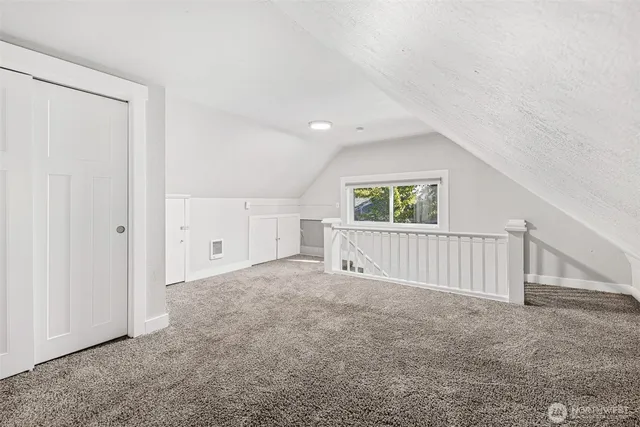 a view of a big room with windows and entryway