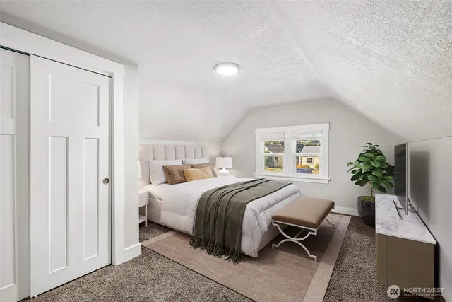 a bed room with a bed and a couch