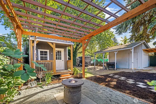a front view of a house with garden and patio